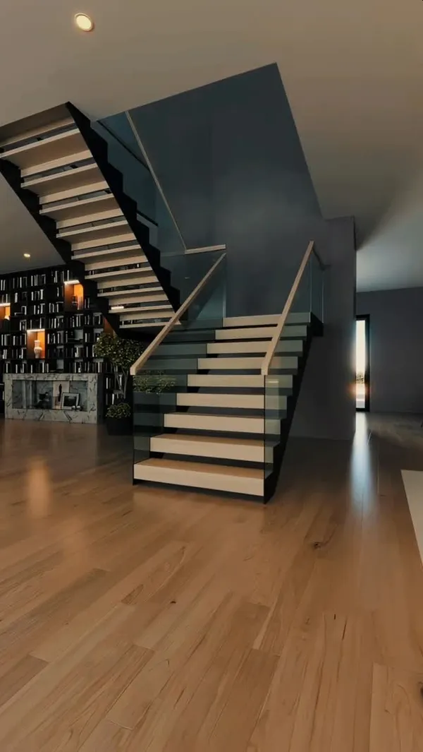 Glass stair railing system in a modern Bay Area open-plan home